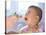 Baby Being Fed Baby Food-null-Stretched Canvas