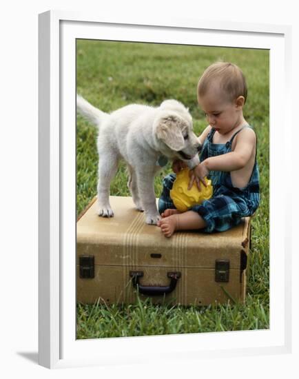 Baby Girl Playing with Puppy-Chris Lowe-Framed Premium Photographic Print