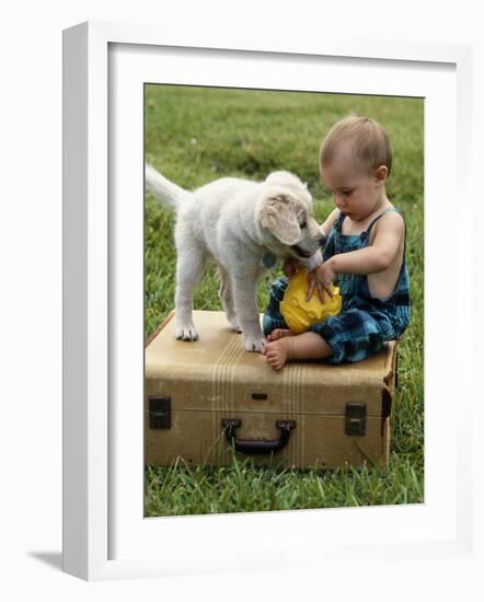 Baby Girl Playing with Puppy-Chris Lowe-Framed Photographic Print