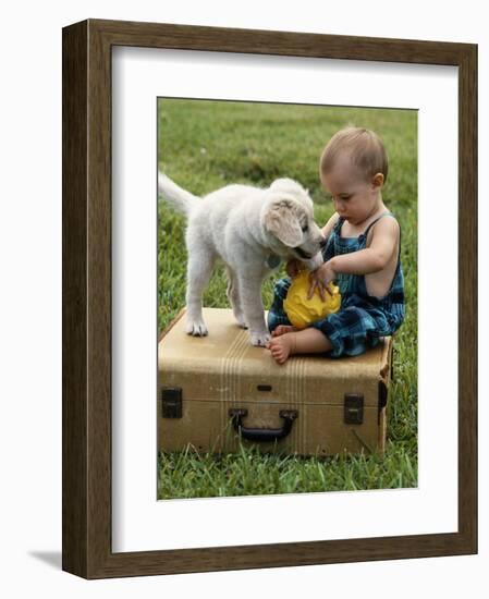 Baby Girl Playing with Puppy-Chris Lowe-Framed Photographic Print