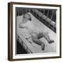 Baby Sleeping on its Stomach in Nursery at St. Vincent's Hospital-Nina Leen-Framed Photographic Print