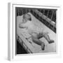 Baby Sleeping on its Stomach in Nursery at St. Vincent's Hospital-Nina Leen-Framed Photographic Print