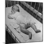 Baby Sleeping on its Stomach in Nursery at St. Vincent's Hospital-Nina Leen-Mounted Photographic Print