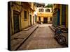 Back Street of Luxor Town, Egypt with Motorbike-Clive Nolan-Stretched Canvas