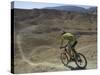 Back View of Competitior Riding Downhill in Mount Sodom International Mountain Bike Race, Israel-Eitan Simanor-Stretched Canvas