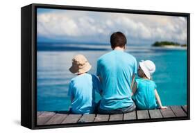 Back View of Father and Kids Sitting on Wooden Dock Looking to Ocean-BlueOrange Studio-Framed Stretched Canvas