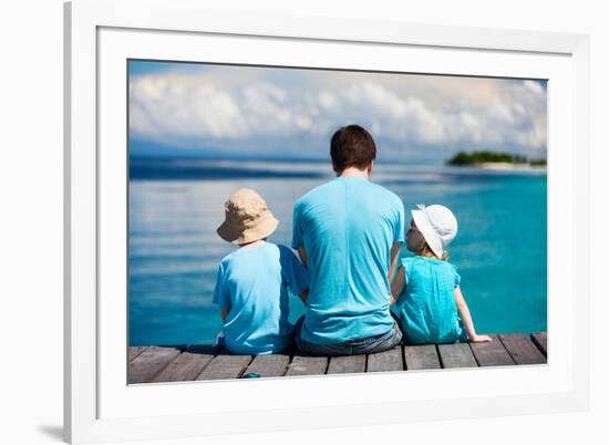 Back View of Father and Kids Sitting on Wooden Dock Looking to Ocean-BlueOrange Studio-Framed Photographic Print