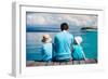 Back View of Father and Kids Sitting on Wooden Dock Looking to Ocean-BlueOrange Studio-Framed Photographic Print