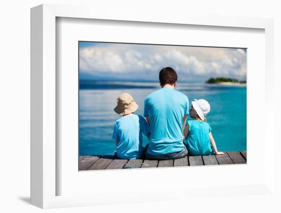 Back View of Father and Kids Sitting on Wooden Dock Looking to Ocean-BlueOrange Studio-Framed Photographic Print