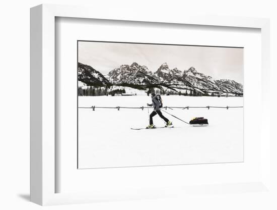 Backcountry skier under the Tetons, Grand Teton National Park, Wyoming, USA-Russ Bishop-Framed Photographic Print