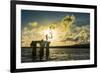 Backlit local boys jumping into the water of the lagoon of Wallis from a platform, Wallis and Futun-Michael Runkel-Framed Photographic Print