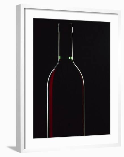 Backlit Shot of a Bottle of Red Wine-Lee Frost-Framed Photographic Print