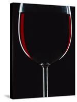 Backlit Shot of a Glass of Red Wine-Lee Frost-Stretched Canvas