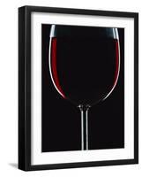 Backlit Shot of a Glass of Red Wine-Lee Frost-Framed Photographic Print