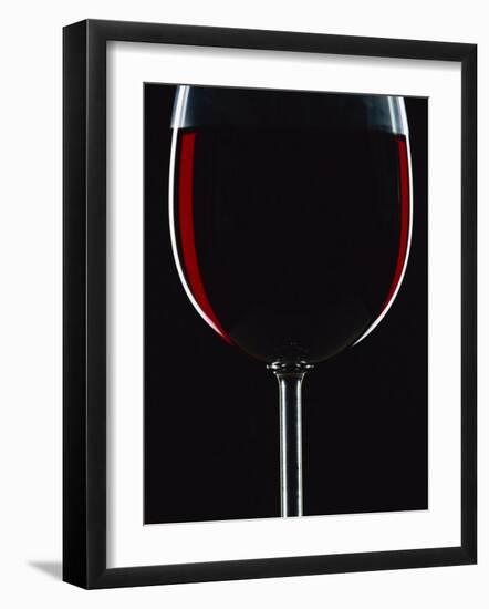 Backlit Shot of a Glass of Red Wine-Lee Frost-Framed Photographic Print