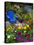 Backyard Flower Garden With Chair-Darrell Gulin-Stretched Canvas