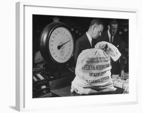 Bag of Checks Being Weighed on Scale at Bank-Herbert Gehr-Framed Photographic Print