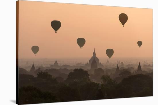 Bagan, balloons flying over ancient temples-Sarawut Intarob-Stretched Canvas