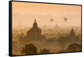 Bagan, Mandalay region, Myanmar (Burma). Pagodas and temples with balloons at sunrise.-Marco Bottigelli-Framed Stretched Canvas