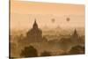 Bagan, Mandalay region, Myanmar (Burma). Pagodas and temples with balloons at sunrise.-Marco Bottigelli-Stretched Canvas