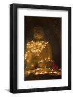 Bagan, Mandalay region, Myanmar (Burma). Young monk praying at a giant brick-make statue of the Bud-Marco Bottigelli-Framed Photographic Print