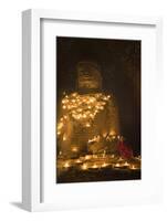 Bagan, Mandalay region, Myanmar (Burma). Young monk praying at a giant brick-make statue of the Bud-Marco Bottigelli-Framed Photographic Print