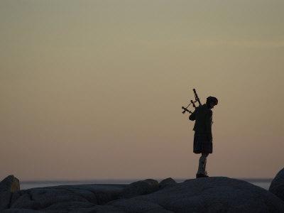 black bagpipe player image black bagpipe player image
