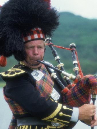 black bagpipe player image black bagpipe player image