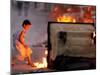 Bahraini Child Plays Near to Burning Tires and a Dumpster-null-Mounted Photographic Print