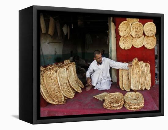 Baker Arranges Breads at His Shop in Kandahar Province, South of Kabul, Afghanistan-null-Framed Stretched Canvas