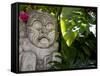 Bali, Ubud, a Stone Carving, Adorned with a Hibiscus Flower, Sits in Tropical Gardens-Niels Van Gijn-Framed Stretched Canvas