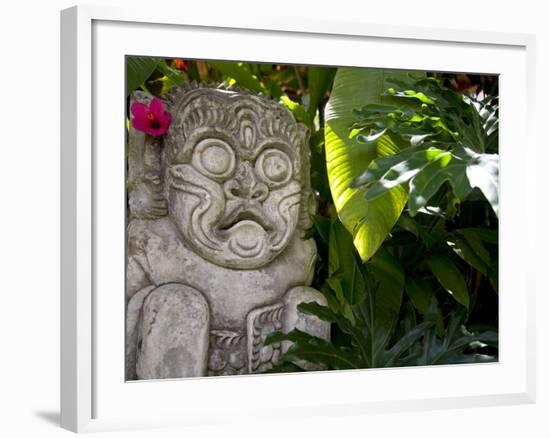 Bali, Ubud, a Stone Carving, Adorned with a Hibiscus Flower, Sits in Tropical Gardens-Niels Van Gijn-Framed Photographic Print