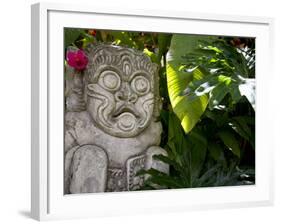 Bali, Ubud, a Stone Carving, Adorned with a Hibiscus Flower, Sits in Tropical Gardens-Niels Van Gijn-Framed Photographic Print