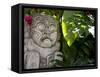 Bali, Ubud, a Stone Carving, Adorned with a Hibiscus Flower, Sits in Tropical Gardens-Niels Van Gijn-Framed Stretched Canvas
