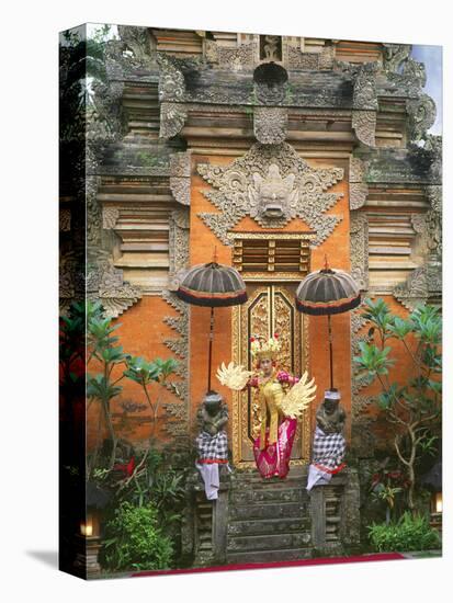 Balinese Dancer Wearing Traditional Garb Near Palace Doors in Ubud, Bali, Indonesia-Jim Zuckerman-Stretched Canvas