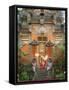 Balinese Dancer Wearing Traditional Garb Near Palace Doors in Ubud, Bali, Indonesia-Jim Zuckerman-Framed Stretched Canvas