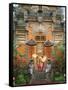 Balinese Dancer Wearing Traditional Garb Near Palace Doors in Ubud, Bali, Indonesia-Jim Zuckerman-Framed Stretched Canvas