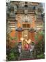 Balinese Dancer Wearing Traditional Garb Near Palace Doors in Ubud, Bali, Indonesia-Jim Zuckerman-Mounted Photographic Print