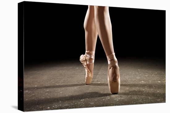 Ballerina Balancing En Pointe-null-Stretched Canvas