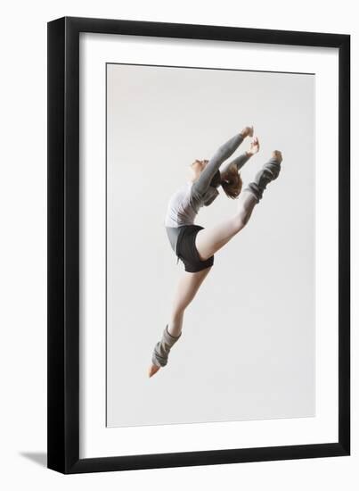 Ballerina Leaping in Mid-Air-null-Framed Photo