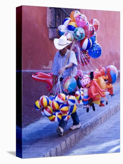 Balloon Vendor Walking the Streets, San Miguel De Allende, Mexico-Nancy Rotenberg-Stretched Canvas