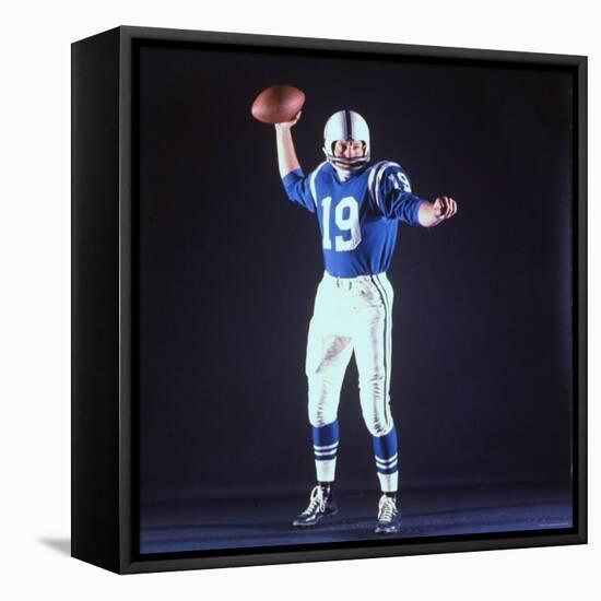 Baltimore Colts Football Player Johnny Unitas in Uniform While Holding Ball in Passing Stance-Yale Joel-Framed Stretched Canvas