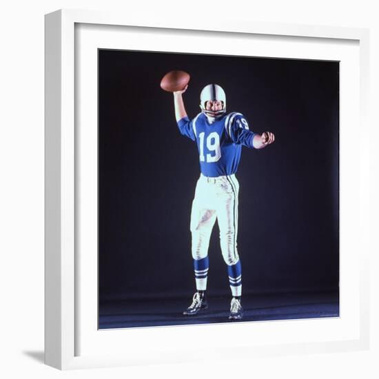 Baltimore Colts Football Player Johnny Unitas in Uniform While Holding Ball in Passing Stance-Yale Joel-Framed Premium Photographic Print