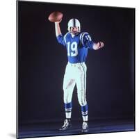 Baltimore Colts Football Player Johnny Unitas in Uniform While Holding Ball in Passing Stance-Yale Joel-Mounted Premium Photographic Print