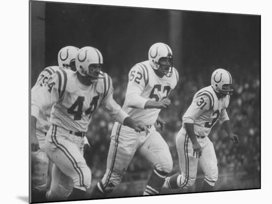 Baltimore Colts Playing Against the New York Giants-null-Mounted Premium Photographic Print