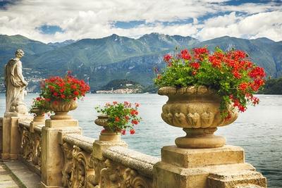 https://imgc.allpostersimages.com/img/posters/balustrade-with-lake-view-como-italy_u-L-Q1ITFV50.jpg?artPerspective=n