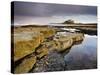 Bamburgh Castle Bathed in Evening Light with Foreground of Barnacle-Encrusted Rocks and Rock Pools-Lee Frost-Stretched Canvas