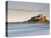 Bamburgh Castle Bathed in Golden Evening Light Overlooking Bamburgh Bay with the Sea Filling the Fo-Lee Frost-Stretched Canvas