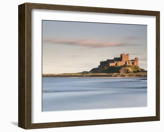 Bamburgh Castle Bathed in Golden Evening Light Overlooking Bamburgh Bay with the Sea Filling the Fo-Lee Frost-Framed Photographic Print