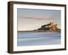 Bamburgh Castle Bathed in Golden Evening Light Overlooking Bamburgh Bay with the Sea Filling the Fo-Lee Frost-Framed Photographic Print